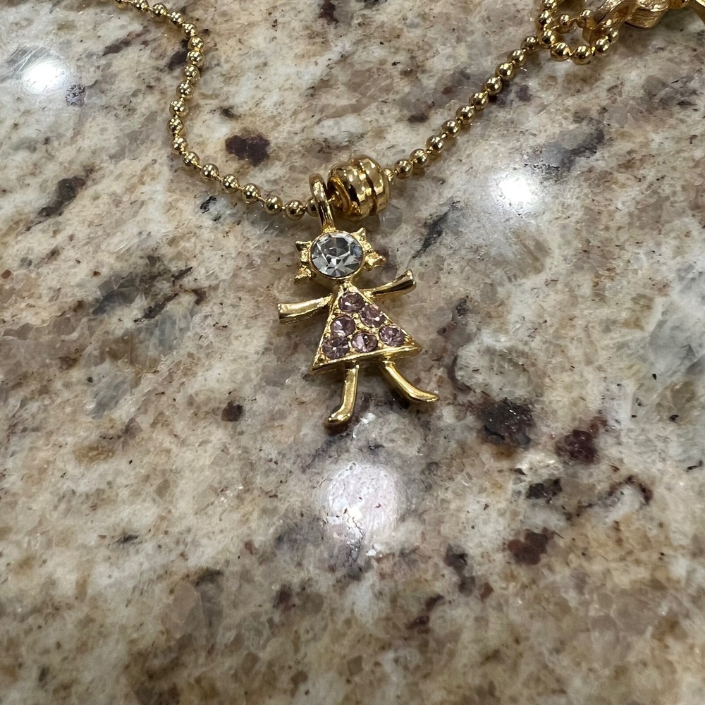 K.I.S. USA Gold Tone Stick Figure Girl Pendant Rhinestone purple February